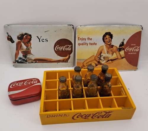 4 Vintage Coca Cola Items. Miniture Crate with 7 Coke bottles, 2 Metal Postcards and note Tin