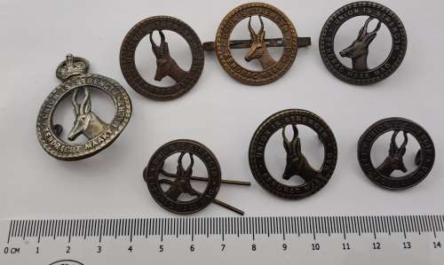 7 x South African Infantry Brigade Cap Badges -1 x WW1 and 6 x WW2
