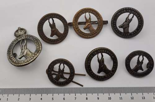 7 x South African Infantry Brigade Cap Badges -1 x WW1 and 6 x WW2