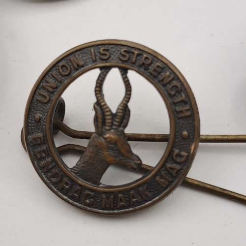 7 x South African Infantry Brigade Cap Badges -1 x WW1 and 6 x WW2