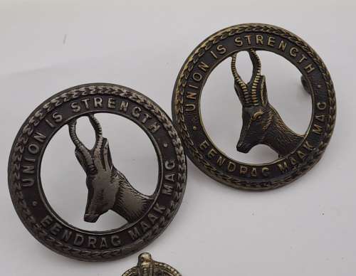 7 x South African Infantry Brigade Cap Badges -1 x WW1 and 6 x WW2