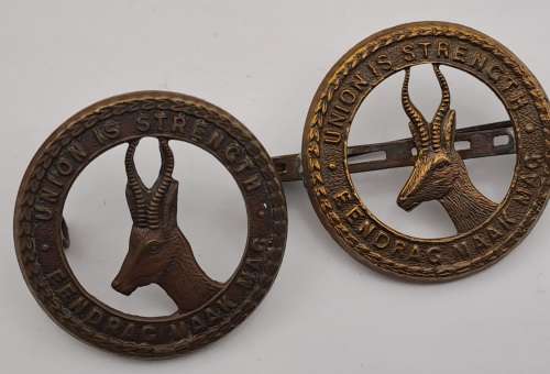 7 x South African Infantry Brigade Cap Badges -1 x WW1 and 6 x WW2