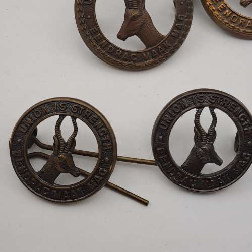 7 x South African Infantry Brigade Cap Badges -1 x WW1 and 6 x WW2