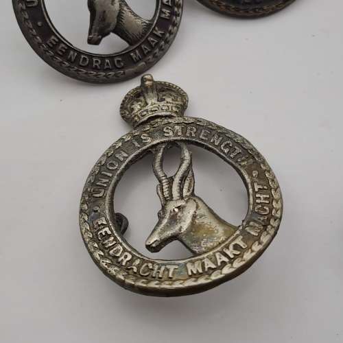 7 x South African Infantry Brigade Cap Badges -1 x WW1 and 6 x WW2