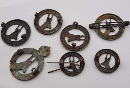 7 x South African Infantry Brigade Cap Badges -1 x WW1 and 6 x WW2