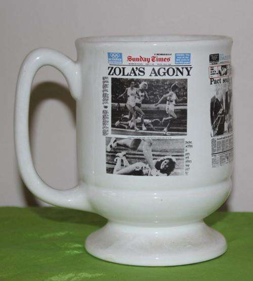A Crescent Ware Mug with 1981 newspapers Prints see all photo's eg .Zola's Agony.