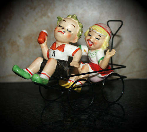 Vintage Porcelain Ornament Boy and Girl on wire wagon 120x136x60mm