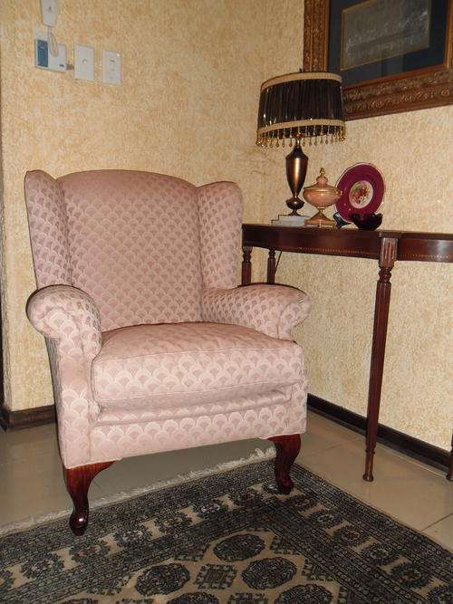 A  Queen Anne wing-back chair