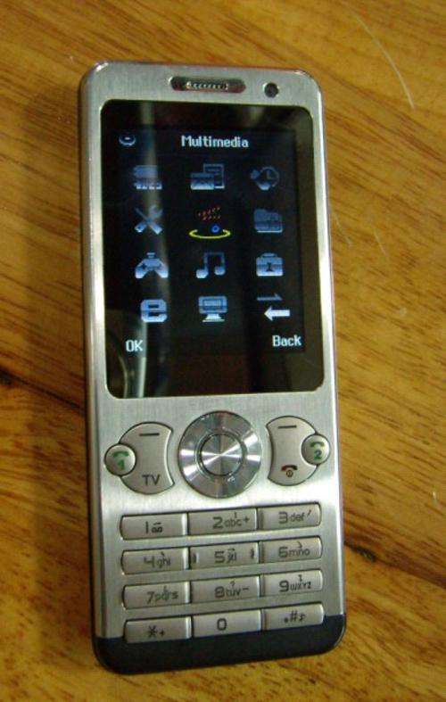 BUILT IN TV CELLPHONE. BEAUTIFUL STEEL CASE . DUAL SIM  STANDBY.LOW SHIPPING COST EXPRESS TO SA.