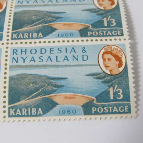 Rhodesia and Nyasaland SACC No. 36 - block of 4 mint stamps with downward shift of orange printing