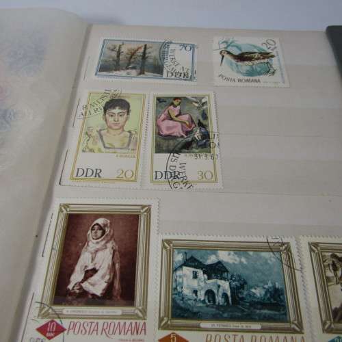 16 Page Stamp album with about 420 world stamps