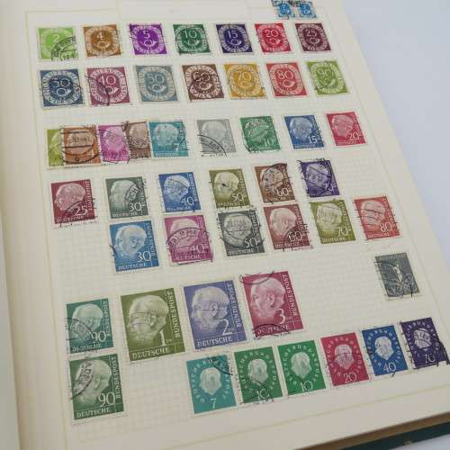 Stamp album with over 1400 stamps including South Africa, China, Switzerland, Britain ect