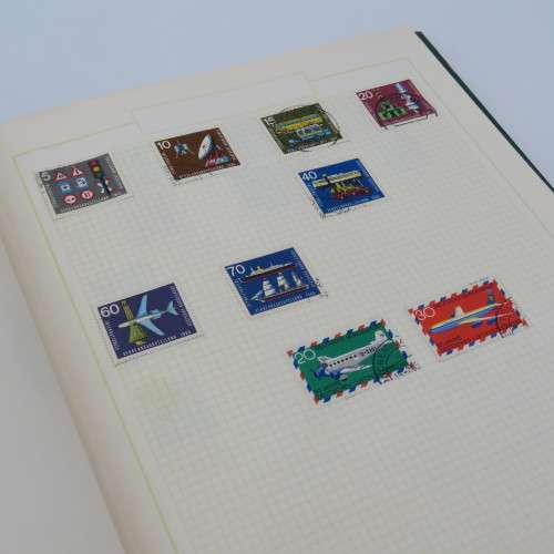 Stamp album with over 1400 stamps including South Africa, China, Switzerland, Britain ect