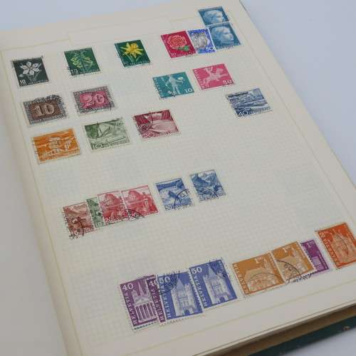 Stamp album with over 1400 stamps including South Africa, China, Switzerland, Britain ect