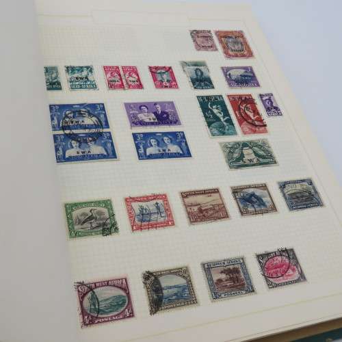 Stamp album with over 1400 stamps including South Africa, China, Switzerland, Britain ect