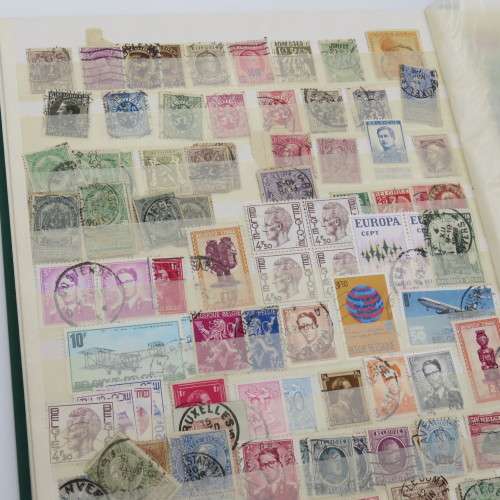 16 Page stamp album with over 700 old stamps - Some better stuff - Have a look at the photos