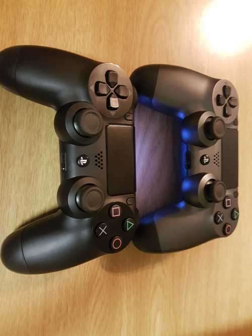 Playstation 4 1TB Console + 2 x Dualshock Controllers (plus 4 games)