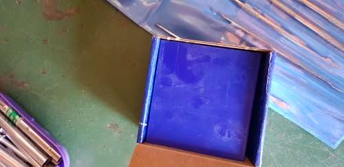 A box full of Jewellery tools Including metal roller and torches.