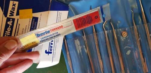 A box full of Jewellery tools Including metal roller and torches.