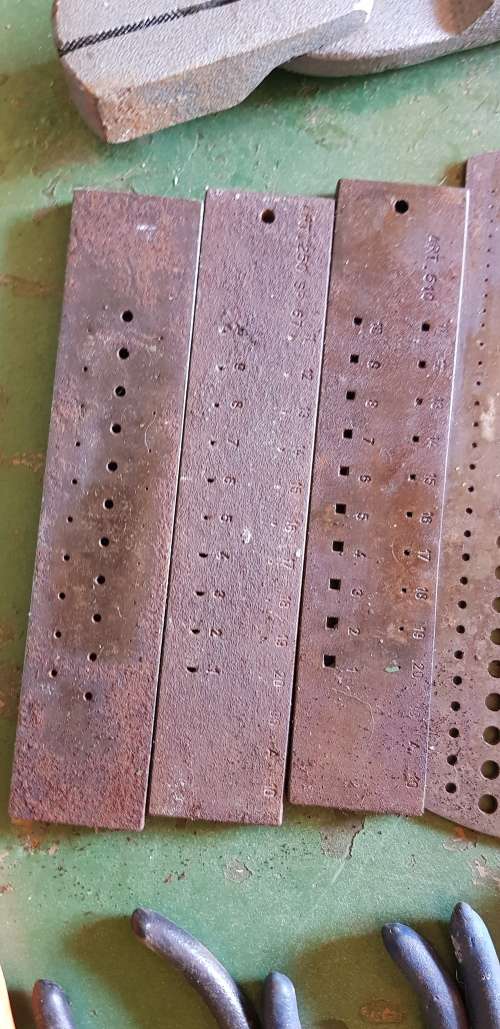 A box full of Jewellery tools Including metal roller and torches.