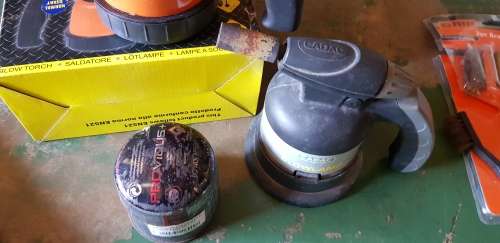 A box full of Jewellery tools Including metal roller and torches.