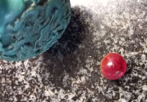 Turquoise coloured snuff bottle with red lid