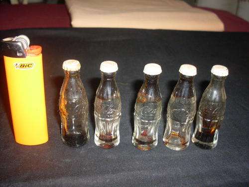 5 miniture coke bottles