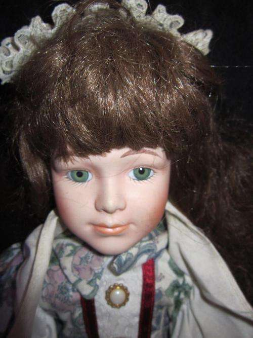 Porcelain Doll +-39cm on a stand