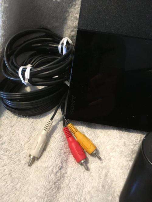 Playstation 2 - Black Slim Line Console c/w 1 x Original Controller, AV Cable Power Cord & 1 x Game