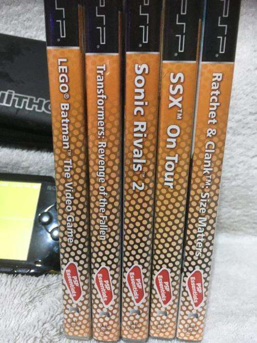 PSP 1001, 2GB Memory Card Charger, Carry Case 5 Games + 4 UMD Music videos