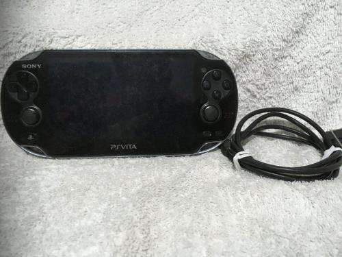 Sony PSVITA PCH1004 c/w Charger + charging cable - no memory card