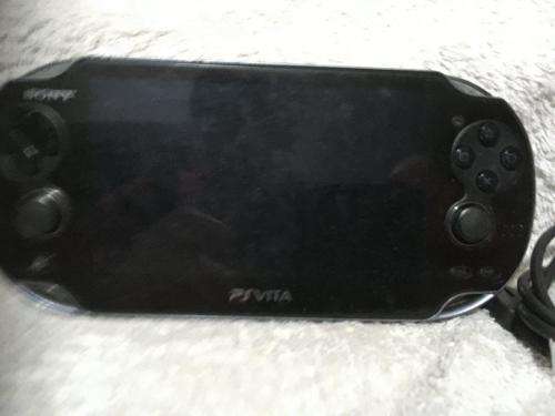 Sony PSVITA PCH1004 c/w Charger + charging cable - no memory card