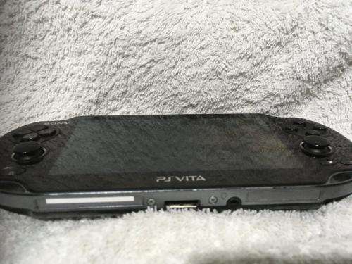 Sony PSVITA PCH1004 c/w Charger + charging cable - no memory card