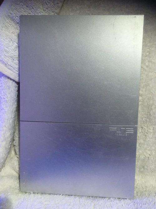 Playstation 2 - Silver Slim Line Console c/w 1 x Original Controller, AV Cable and 1 x Game