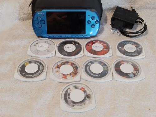 PSP 3004, No memory Card, Charger, 5 Games + 4 UMD Music videos + carry bag - see description