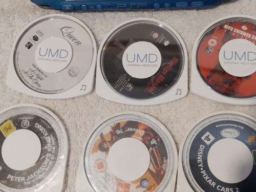 PSP 3004, No memory Card, Charger, 5 Games + 4 UMD Music videos + carry bag - see description