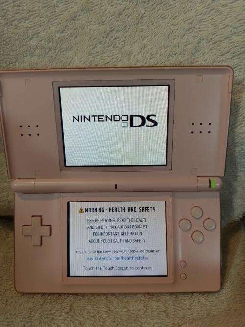 Nintendo DS Lite Pink, c/w Stylus, Generic Charger + Harry Potter Cartridge.