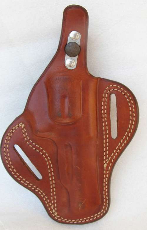 LEATHER GUN HOLSTER : FITS ONTO BELT : 21cm LONG - 9cm ACROSS AT WIDEST PART (LEFT HANDED)
