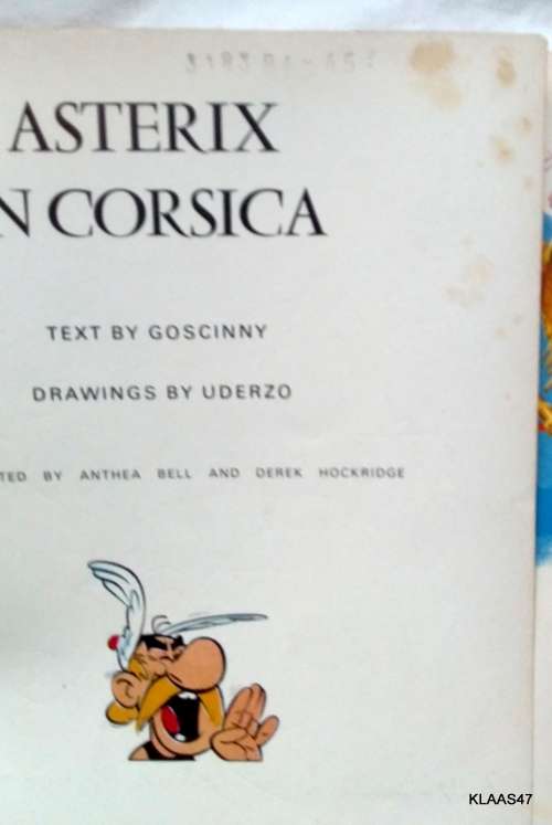 ASTERIX IN CORSICA - PAPERBACK - HODDER DARGAUD - SMALL PEN MARK & STAINS - SEE PICTURES