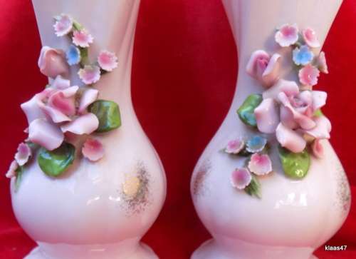 Pair of Vases with applied flowers.