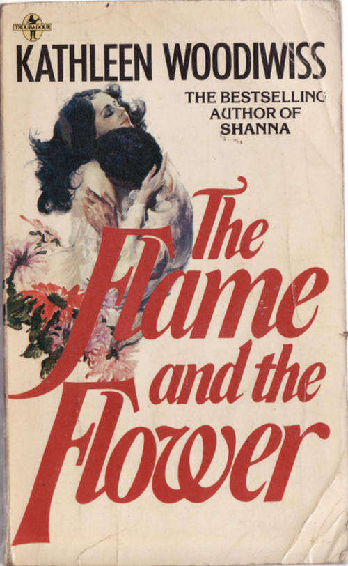 THE FLAME AND THE FLOWER  PAPERBACK BOOK HAS GONE BROWN