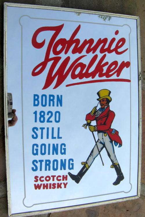 JOHNNIE WALKER : FRAMED - GILT EDGE - WORN IN PLACES : REFLECTIVE BACKGROUND : SIZE - 27.3 x 38.3cm
