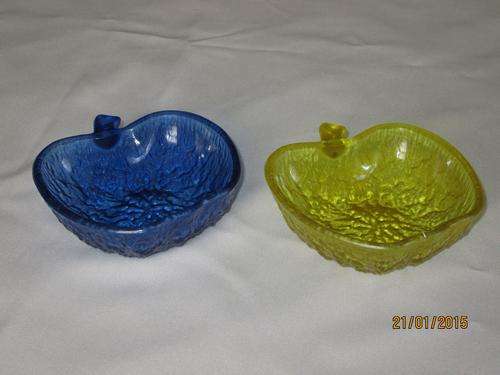 two apple shaped dishes