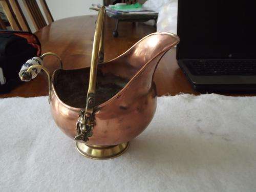 copper bowl with ornate handel