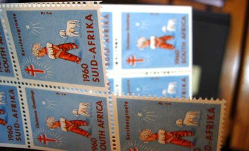 COLLECTION OF 4 UNEXPLODED CHARITY SEAL BOOKLETS - ONE STAMP REMOVED FROM 1960 BOOKLET.