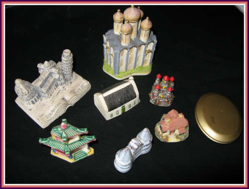 A collection 7 buildings and a small mirror. Vintage.