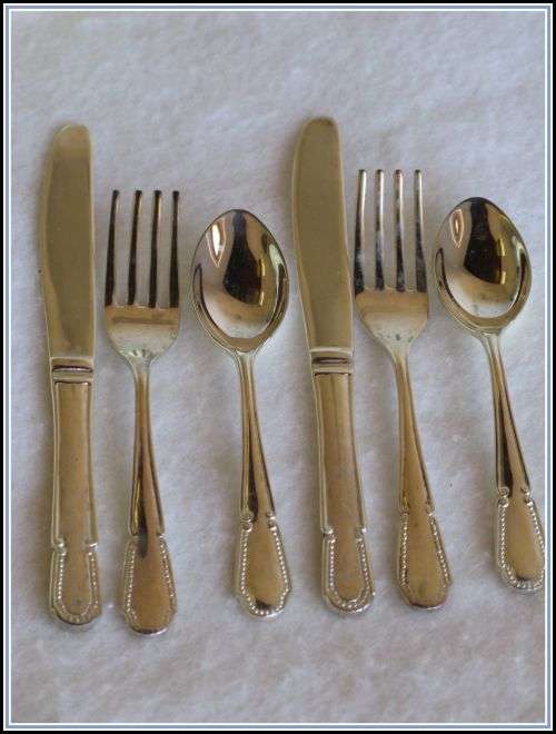 Two sets of children's cutlery