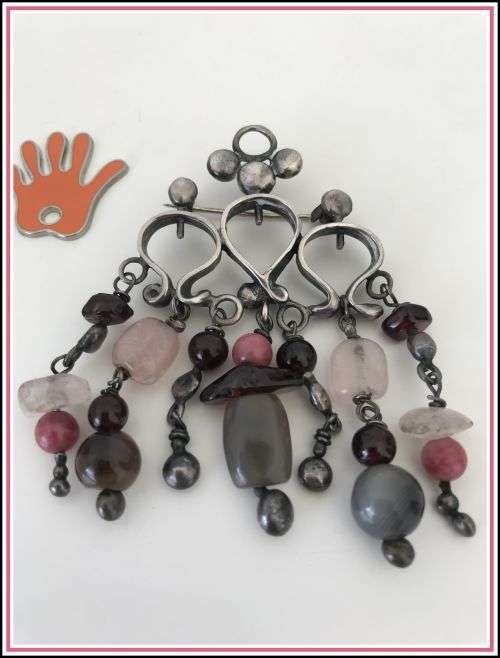 Lovely brooch with smokey semi-precious stones dangling.
