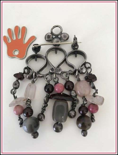 Lovely brooch with smokey semi-precious stones dangling.