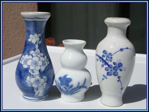 Three small ceramic vases. Blue on White.
